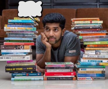 Amrut deshmukh booklet guy sitting on books