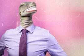 Man wearing pink shirt with dinosaur head