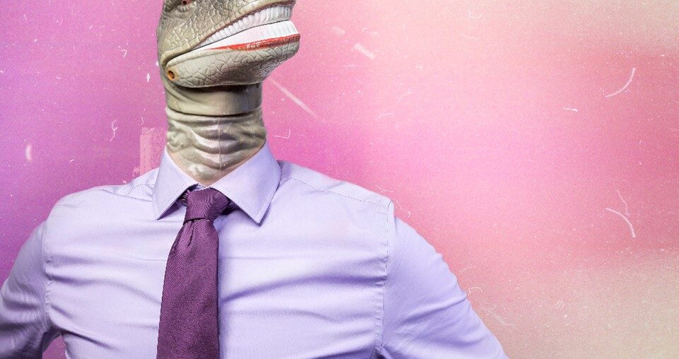 Man wearing pink shirt with dinosaur head