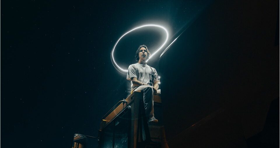 Man sitting with a halo effect on his head