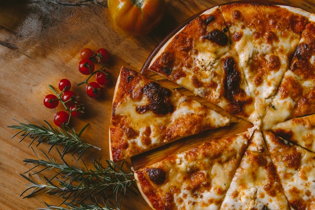 Domino's pizza slice separated from pizza to show digital transformation