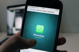 whatsapp on phone in hand to show photo status