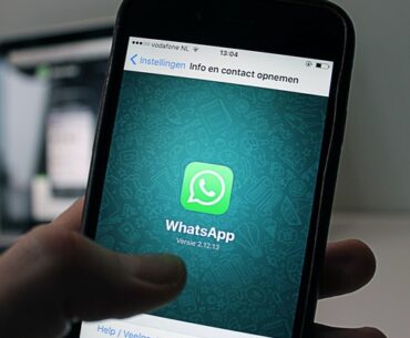 whatsapp on phone in hand to show photo status