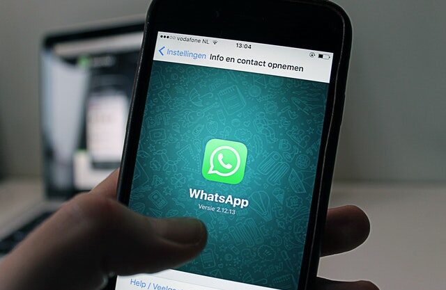 whatsapp on phone in hand to show photo status